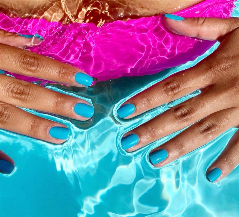 Bright blue manicure. 