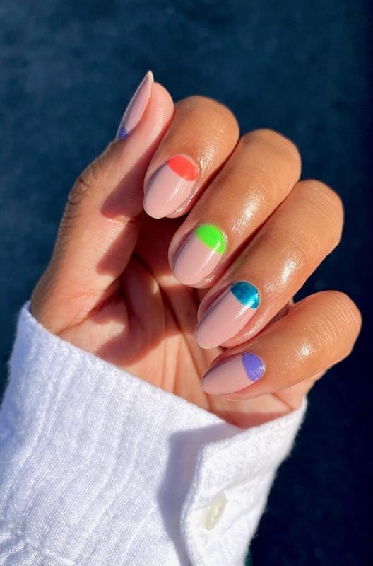 Nude nail color with purple, pink, neon green, and blue design.