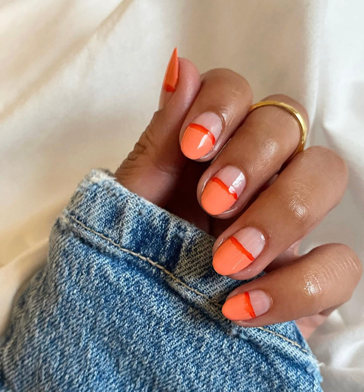 Orange and red nail design. 