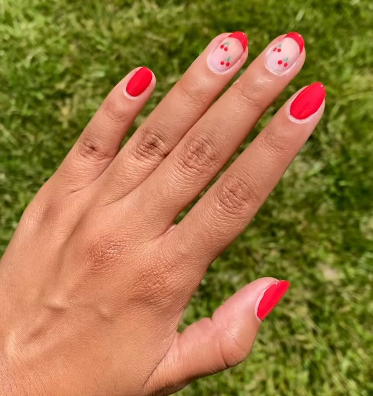 Red cherry nail design.