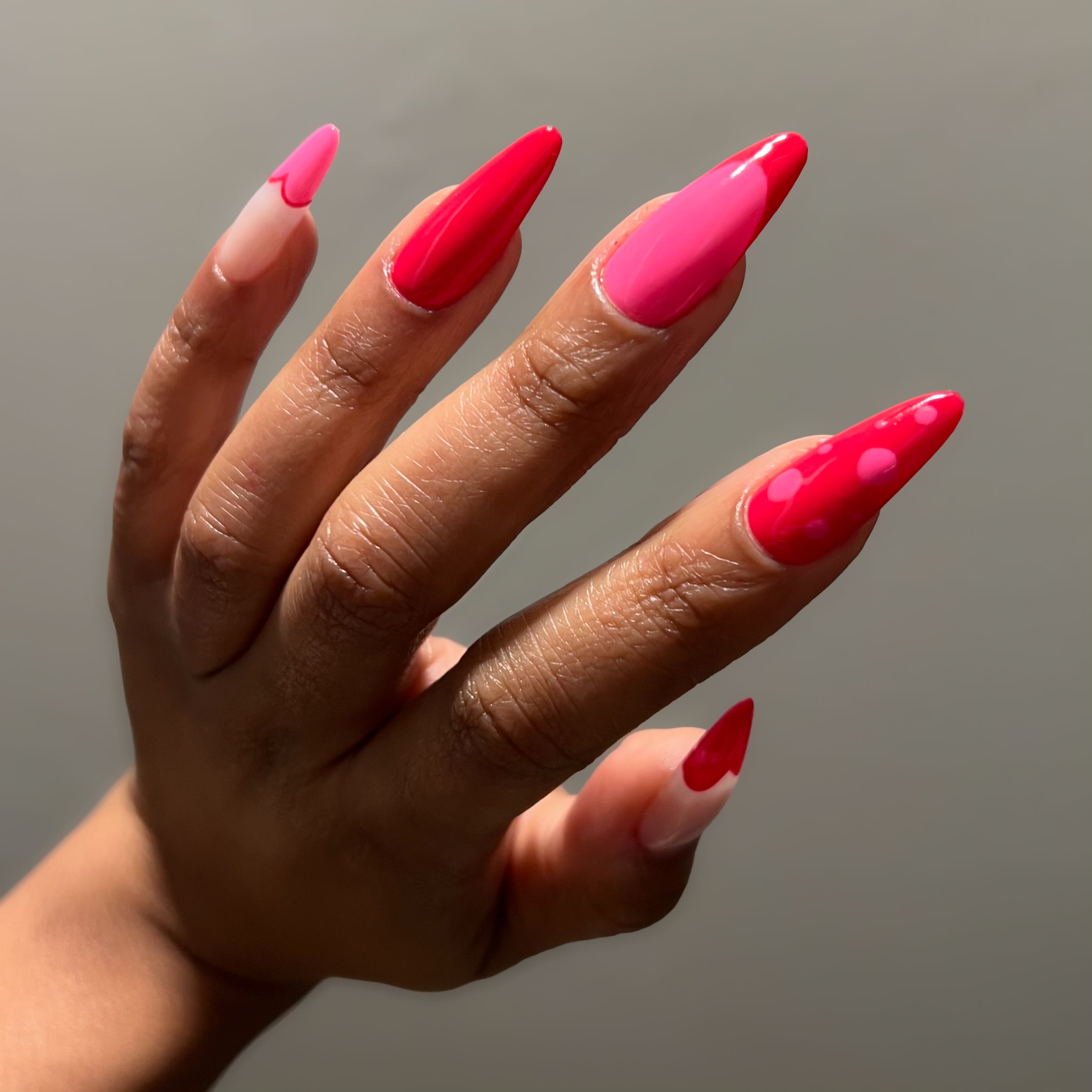 Pink and red nail design. 
